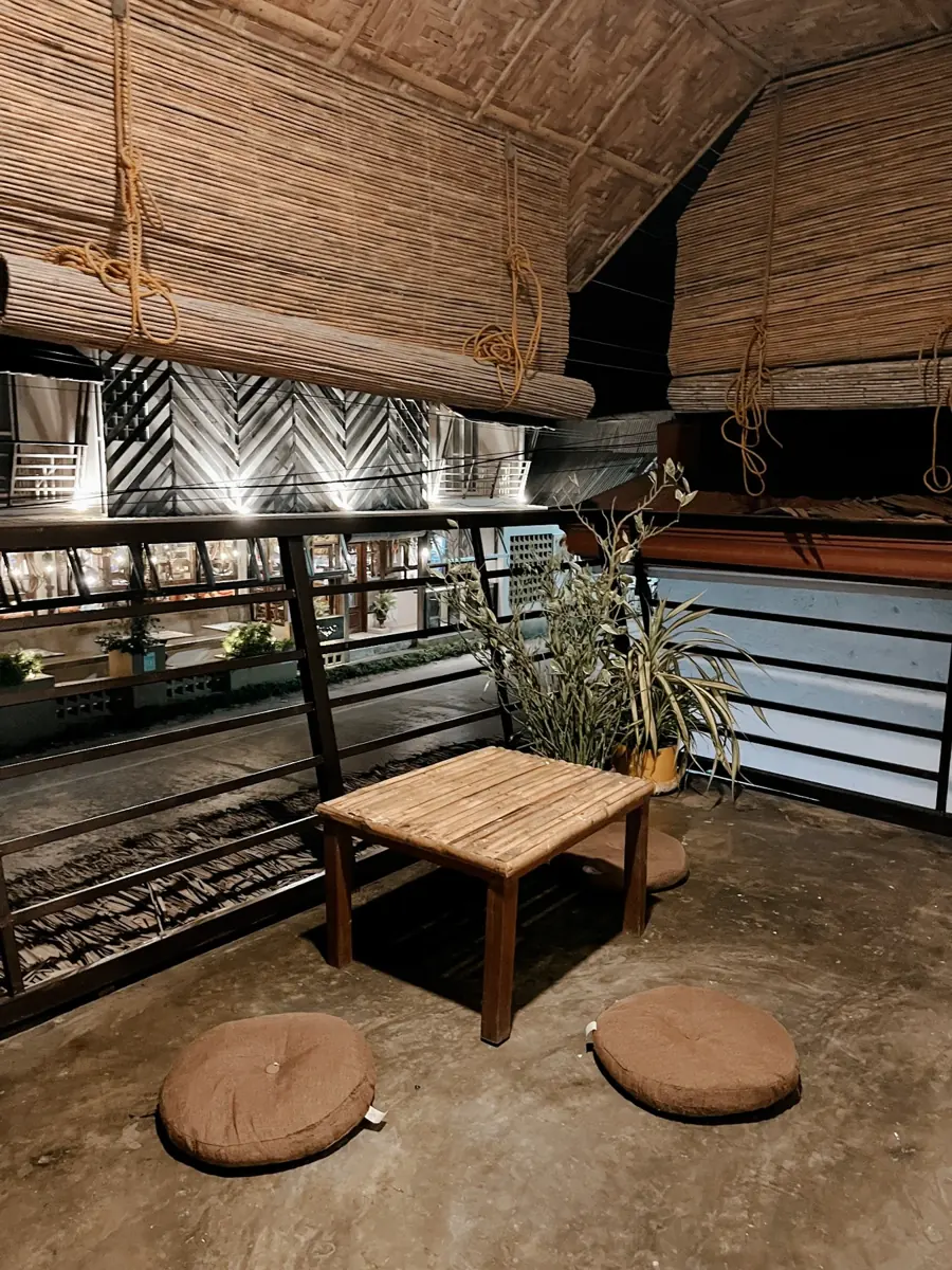 The Eight Siargao shared terrace with a low table and floor cushions